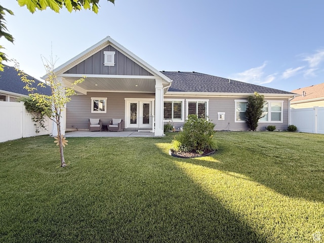 1302 E Mary Ln, Layton, UT 84040 - rear view of house featuring board and batten siding, a fenced backyard, a patio, french doors, and an outdoor hangout area