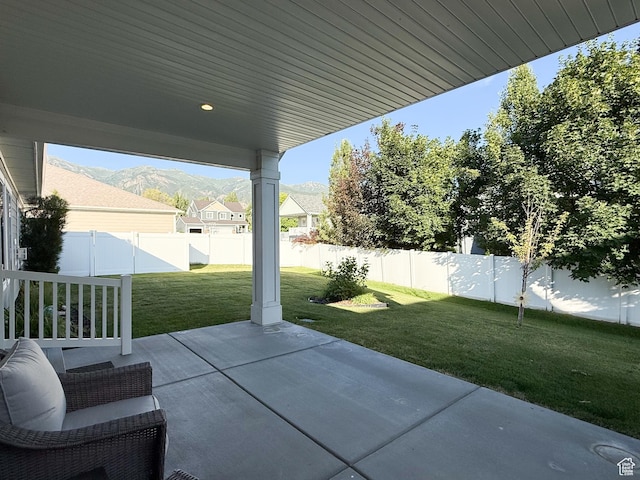 1302 E Mary Ln, Layton, UT 84040 - fenced backyard with a patio area and a mountain view
