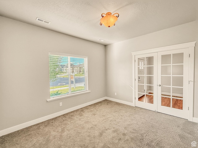 1302 E Mary Ln, Layton, UT 84040 - carpeted empty room featuring french doors and a textured ceiling