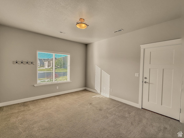 1302 E Mary Ln, Layton, UT 84040 - empty room featuring light colored carpet and a textured ceiling