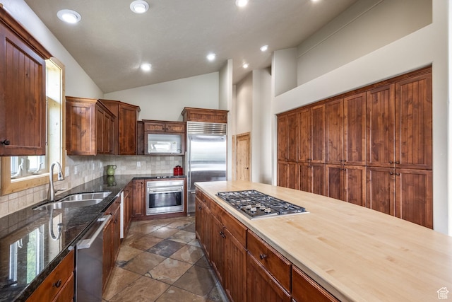 1297 W Lime Canyon Way N, Midway, UT 84049 - kitchen featuring stainless steel appliances, backsplash, recessed lighting, dark stone counters, and lofted ceiling