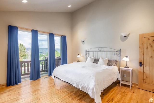 1297 W Lime Canyon Way N, Midway, UT 84049 - bedroom featuring access to outside, multiple windows, light wood finished floors, recessed lighting, and high vaulted ceiling