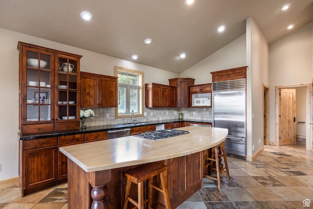 1297 W Lime Canyon Way N, Midway, UT 84049 - kitchen with stainless steel appliances, a kitchen breakfast bar, a center island, backsplash, and recessed lighting