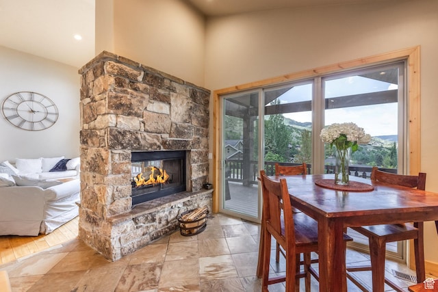 1297 W Lime Canyon Way N, Midway, UT 84049 - dining space featuring a stone fireplace and vaulted ceiling