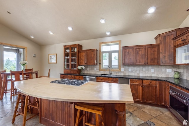 1297 W Lime Canyon Way N, Midway, UT 84049 - kitchen featuring stainless steel appliances, tasteful backsplash, lofted ceiling, a kitchen breakfast bar, and recessed lighting