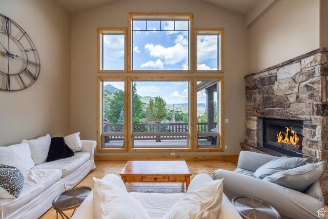 1297 W Lime Canyon Way N, Midway, UT 84049 - living area with plenty of natural light, a fireplace, wood finished floors, and high vaulted ceiling