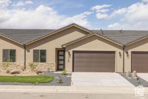 2140 W 320 S Unit 48-51, Hurricane, UT 84737 - ranch-style house featuring an attached garage, concrete driveway, and stucco siding