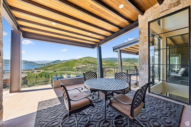 13690 N Deer Canyon Dr, Kamas, UT 84036 - balcony featuring a mountain view and outdoor dining area