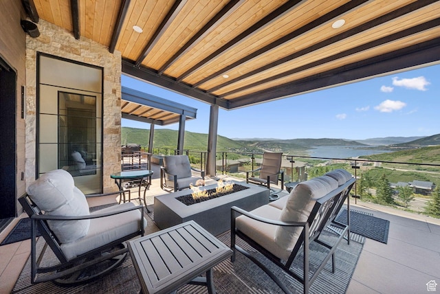 13690 N Deer Canyon Dr, Kamas, UT 84036 - view of patio / terrace with a fire pit and a mountain view