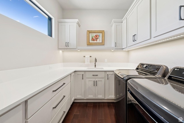 13690 N Deer Canyon Dr, Kamas, UT 84036 - washroom with washer and clothes dryer, dark wood-style flooring, and cabinet space