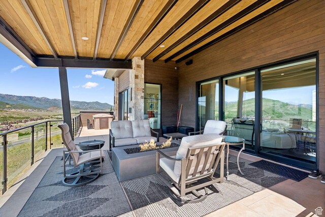 13690 N Deer Canyon Dr, Kamas, UT 84036 - patio / terrace with a mountain view and an outdoor living space with a fire pit