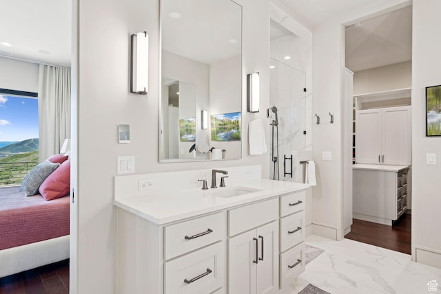 13690 N Deer Canyon Dr, Kamas, UT 84036 - bathroom with ensuite bath, vanity, a stall shower, marble finish flooring, and recessed lighting