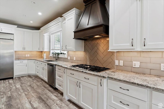 2718 N 2125 E, Layton, UT 84040 - kitchen featuring stainless steel appliances, custom range hood, white cabinets, and recessed lighting