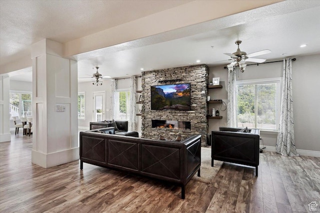 2718 N 2125 E, Layton, UT 84040 - living area featuring ceiling fan, wood finished floors, a textured ceiling, healthy amount of natural light, and recessed lighting