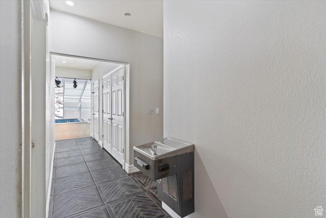 2718 N 2125 E, Layton, UT 84040 - hall featuring dark tile patterned flooring and a textured wall