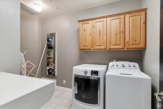 2718 N 2125 E, Layton, UT 84040 - laundry room featuring cabinet space, independent washer and dryer, and light tile patterned floors