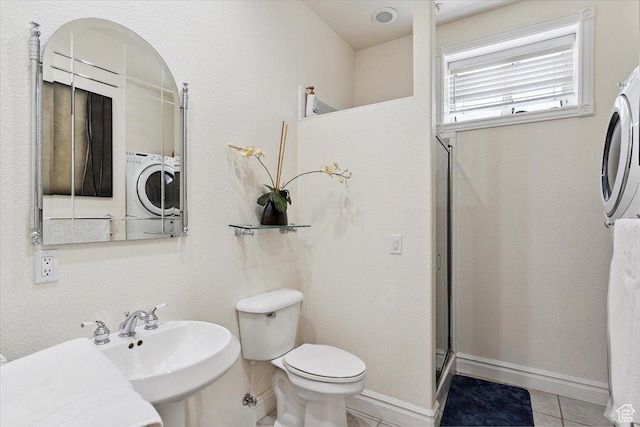 2718 N 2125 E, Layton, UT 84040 - full bath featuring tile patterned floors, a shower with door, and washer / dryer