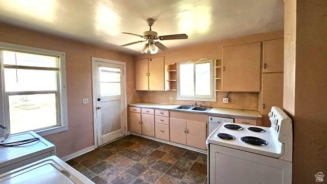 231 E 200 N, Vernal, UT 84078 - kitchen with white electric range oven, ceiling fan, light countertops, stone finish floors, and open shelves
