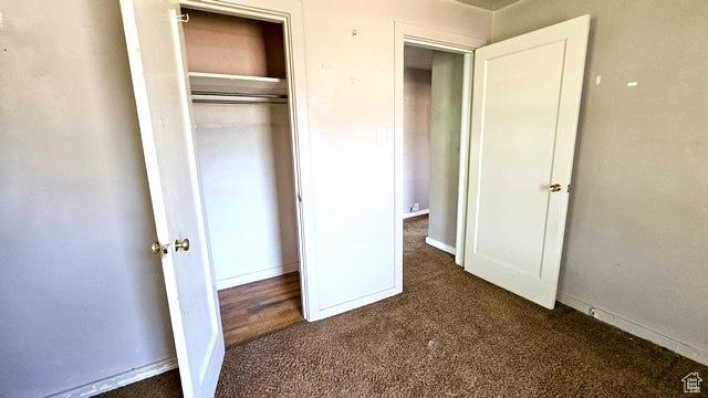 231 E 200 N, Vernal, UT 84078 - unfurnished bedroom with dark colored carpet and a closet