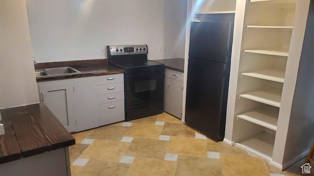 985 Jackson Ave, Ogden, UT 84404 - kitchen featuring black appliances, dark countertops, and built in features