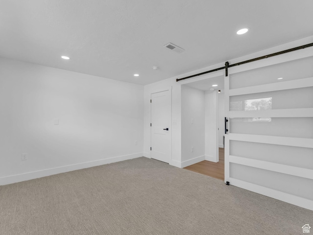 6685 S 3380 W, West Jordan, UT 84084 - basement with carpet floors, a barn door, and recessed lighting
