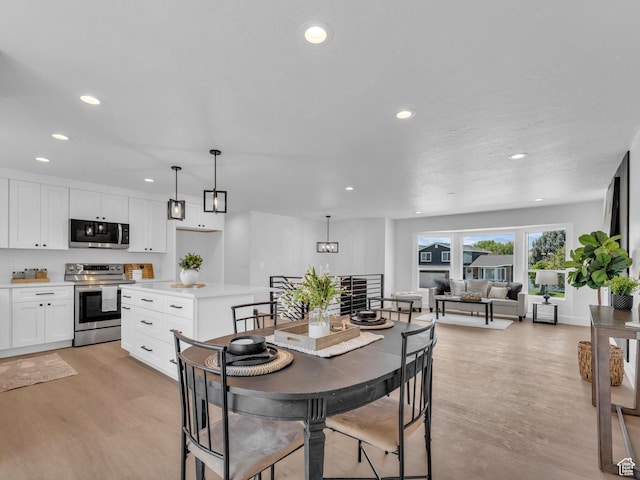 6685 S 3380 W, West Jordan, UT 84084 - dining area with light wood finished floors and recessed lighting