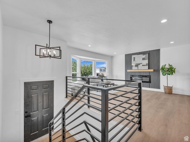 6685 S 3380 W, West Jordan, UT 84084 - stairs with wood finished floors, a chandelier, recessed lighting, and a fireplace