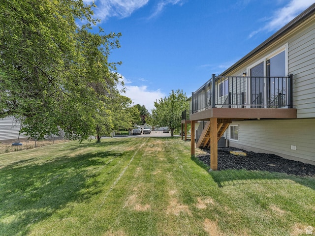 6685 S 3380 W, West Jordan, UT 84084 - view of green lawn with stairs and a deck