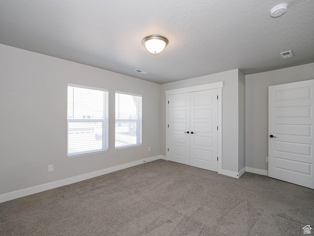928 E Blackfeet Dr, Eagle Mountain, UT 84005 - unfurnished bedroom featuring carpet and a closet
