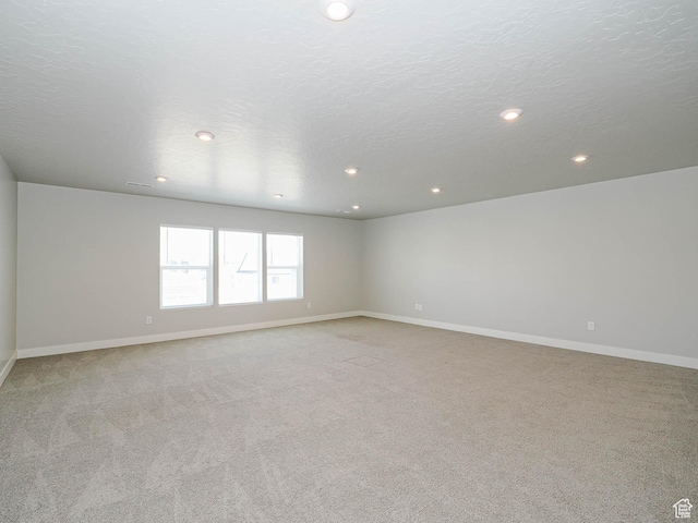 928 E Blackfeet Dr, Eagle Mountain, UT 84005 - unfurnished room with light carpet and recessed lighting