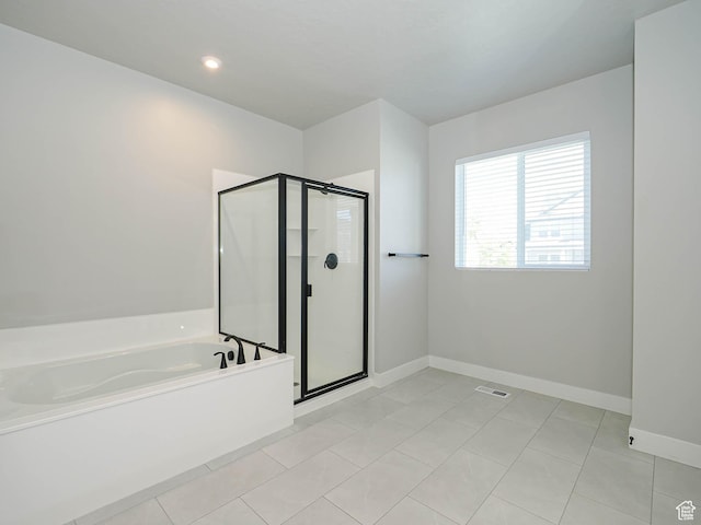 928 E Blackfeet Dr, Eagle Mountain, UT 84005 - full bath with a bath, a shower stall, and tile patterned floors