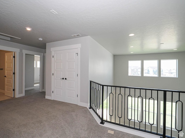 928 E Blackfeet Dr, Eagle Mountain, UT 84005 - corridor with carpet flooring, recessed lighting, and a textured ceiling