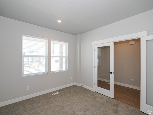 928 E Blackfeet Dr, Eagle Mountain, UT 84005 - unfurnished room with french doors, carpet, and recessed lighting