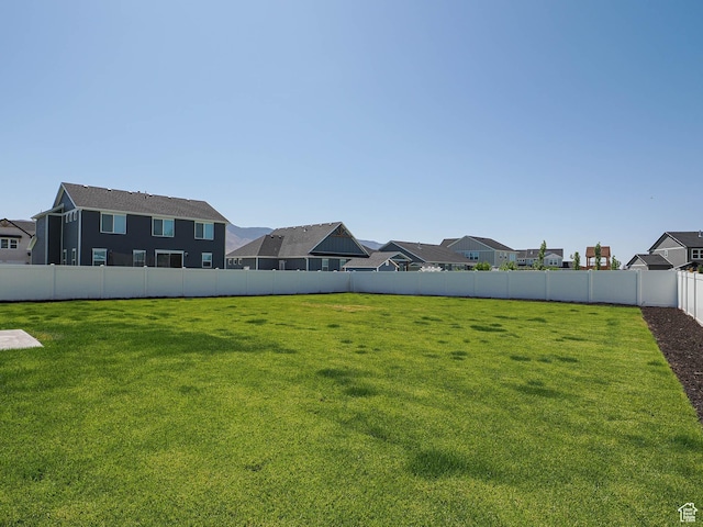 928 E Blackfeet Dr, Eagle Mountain, UT 84005 - fenced yard featuring a residential view