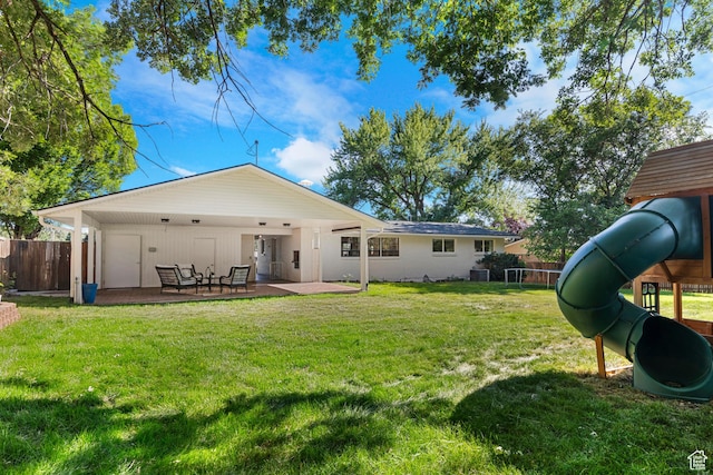 1556 E Shadow Valley Dr, Ogden, UT 84403 - rear view of house with a patio area and a playground