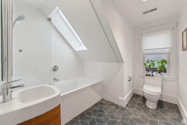 853 E Second Ave N, Salt Lake City, UT 84103 - bathroom featuring a skylight, tile patterned floors, vanity, tiled shower / bath combo, and lofted ceiling