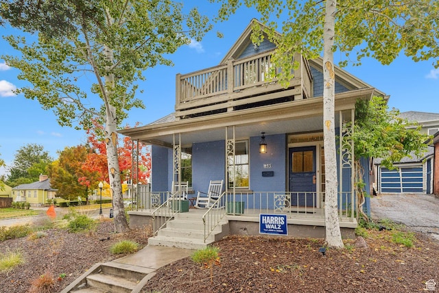 853 E Second Ave N, Salt Lake City, UT 84103 - view of front of house featuring a porch, an attached garage, and asphalt driveway