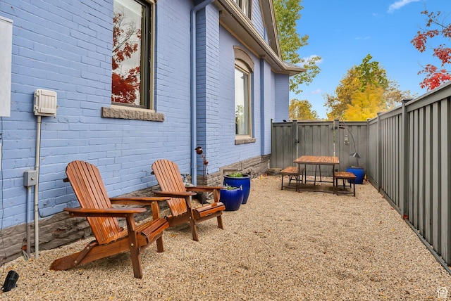 853 E Second Ave N, Salt Lake City, UT 84103 - view of side of home featuring brick siding and a fenced backyard