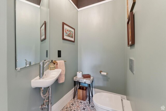 853 E Second Ave N, Salt Lake City, UT 84103 - half bathroom featuring toilet and baseboards