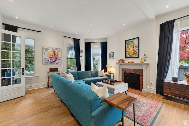 853 E Second Ave N, Salt Lake City, UT 84103 - living room with healthy amount of natural light, light wood-type flooring, a brick fireplace, and recessed lighting