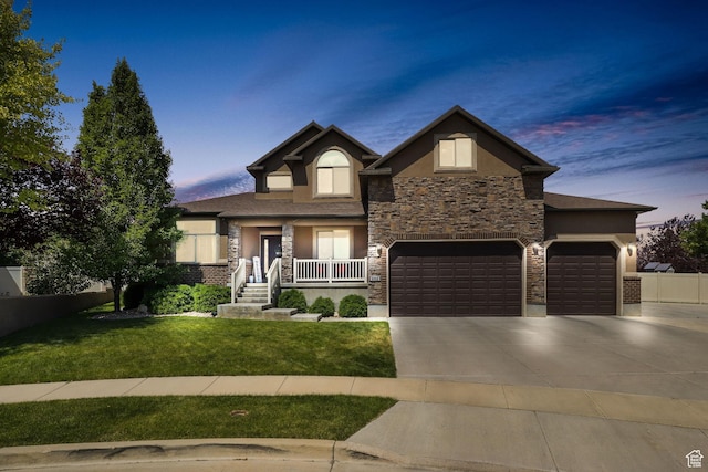 6082 W Cedar Fork Dr S, West Jordan, UT 84081 - view of front of property with stucco siding, stone siding, driveway, a yard, and a garage