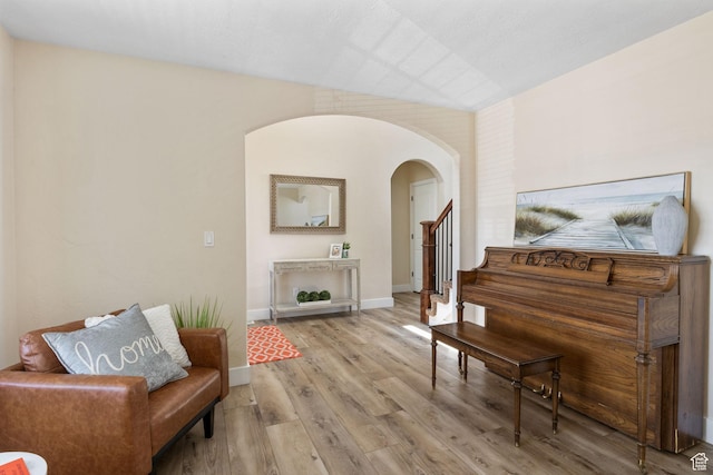 6082 W Cedar Fork Dr S, West Jordan, UT 84081 - living area with arched walkways and wood finished floors