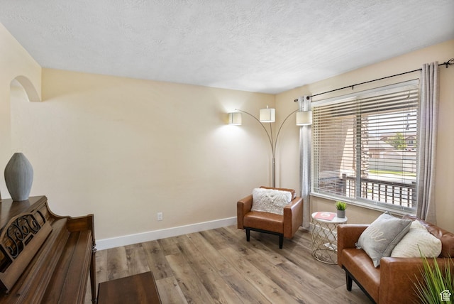 6082 W Cedar Fork Dr S, West Jordan, UT 84081 - sitting room featuring a textured ceiling and wood finished floors