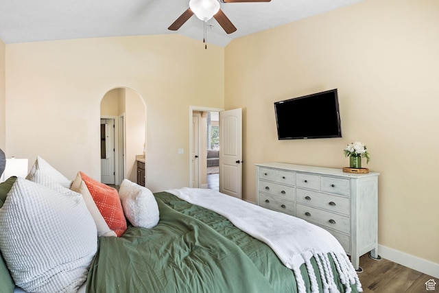 6082 W Cedar Fork Dr S, West Jordan, UT 84081 - bedroom featuring vaulted ceiling, wood finished floors, arched walkways, ceiling fan, and connected bathroom