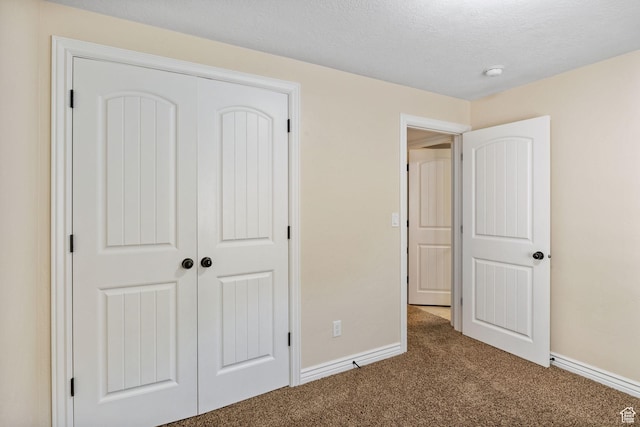 6082 W Cedar Fork Dr S, West Jordan, UT 84081 - unfurnished bedroom with carpet floors, a closet, and a textured ceiling