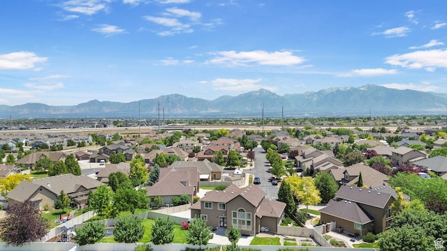 6082 W Cedar Fork Dr S, West Jordan, UT 84081 - aerial view of residential area with a mountain backdrop