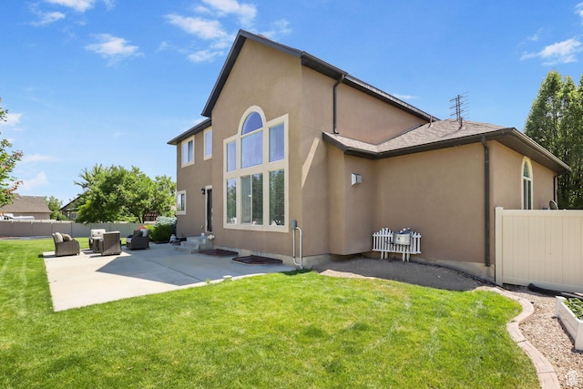6082 W Cedar Fork Dr S, West Jordan, UT 84081 - rear view of property featuring stucco siding and a patio