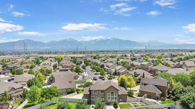 6082 W Cedar Fork Dr S, West Jordan, UT 84081 - aerial view of residential area featuring a mountain backdrop