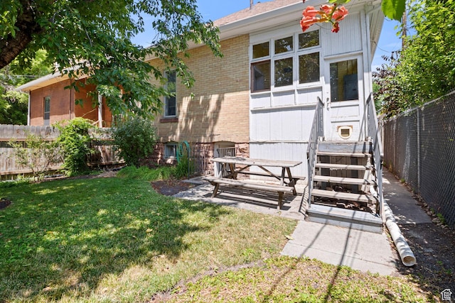 320 E 3rd Ave, Salt Lake City, UT 84103 - back of house with brick siding and a fenced backyard