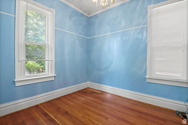 320 E 3rd Ave, Salt Lake City, UT 84103 - spare room with a chandelier, crown molding, and wood finished floors